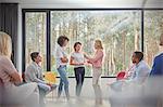 Women standing and talking in group therapy session