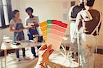 Personal perspective friends viewing color swatches, painting living room