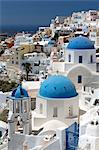 Classic view of the village of Oia with its blue domed churches and colourful houses, Oia, Santorini, Cyclades, Greek Islands, Greece, Europe