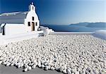 Small whitewashed church against blue sea and sky, Finikia, near Oia, Santorini, Cyclades, Greek Islands, Greece, Europe
