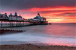 Eastbourne Pier against fiery red sky at sunrise, Eastbourne, East Sussex, England, United Kingdom, Europe