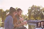 Couple eating cupcakes on canal boat