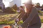 Couple enjoying cycling on marshes