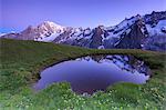 Twilight illuminates Mont Blanc, Mont de la Saxe, Ferret Valley, Courmayeur, Aosta Valley, Italy, Europe