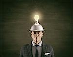 Conceptual image of a businessman and a light bulb overhead.This is a 3d render illustration.
