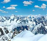 Mont Blanc mountain massif summer landscape with blue cloudy sky (view from Aiguille du Midi Mount, France )