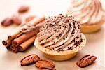Delicious tartlets with chocolate cream, selective focus.