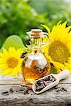Organic sunflower oil in a small glass jar. Close-up