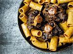 close up of a pan of rustic italian oxtail ragu pasta