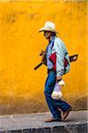 Close-up of a cowboy walking on street in San Miguel de Allende, Mexico