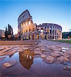 The Colosseum (Flavian Amphitheatre), UNESCO World Heritage Site, reflected in a puddle at dusk, Rome, Lazio, Italy, Europe