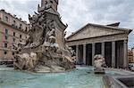 The fountain with statues frames the ancient temple of Pantheon, UNESCO World Heritage Site, Rome, Lazio, Italy, Europe