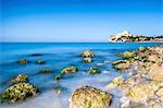 Sunrise on turquoise sea frames the medieval Falconara Castle, Butera, Province of Caltanissetta, Sicily, Italy, Mediterranean, Europe