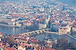 View of typical buildings and ancient churches framed by the River Vltava, Prague, Czech Republic, Europe