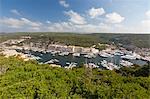 Green vegetation frames the medieval town and harbour, Bonifacio, Corsica, France, Mediterranean, Europe