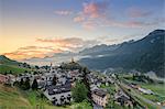 Pink clouds at dawn on the alpine village of Ardez, canton of Graub?nden, district of Inn, lower Engadine, Switzerland, Europe