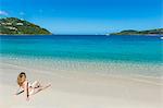 Woman relaxing on Long Bay Beach, Beef Island, Tortola, British Virgin Islands, West Indies, Caribbean, Central America