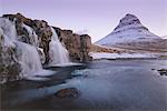 Sunrise at Kirkjufellsfoss and Kirkjufell Mountain, Snaefellsnes Peninsula, Iceland, Polar Regions