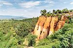 Tourists entering the Ochre trail and view of the ochre quarry, Roussillon, Vaucluse, Provence-Alpes-Cote d'Azur, France, Europe