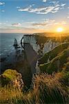 Sun rays at dawn at the cliffs, Etretat, Normandy, France, Europe