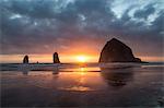 Sunset behind Haystack Rock at Cannon Beach on the Pacific Northwest coast, Oregon, United States of America, North America