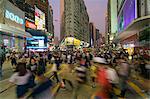 Pedestrians and traffic at a busy road crossing in Causeway Bay, Hong Kong Island, Hong Kong, China, Asia