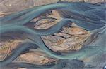 Aerial view of landscape with river coloured by glacial melt.