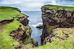 The dramatic cliffs under the Eshaness Lighthouse, Shetland Islands, Scotland, United Kingdom, Europe
