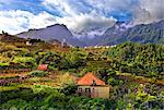 Elevated view of village and tree covered hills and mountains at Lameiros, near Sao Vicente, Madeira, Portugal, Atlantic, Europe