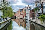 Houses and bridge reflected in the Groenerei canal, Bruges, West Flanders province, Flemish region, Belgium, Europe