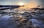 Hot pools and steam from Strokkur Geysir at sunrise, winter, at geothermal area beside the Hvita River, Geysir, Iceland, Polar Regions