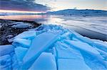 Sunset over frozen Jokulsarlon Glacial Lagoon in winter, South Iceland, Polar Regions