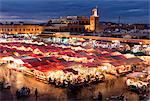 View over the Djemaa el Fna at dusk showing food stalls and shops, Marrakech, Morocco, North Africa, Africa