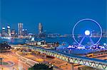 View of Star Ferry pier, observation wheel and Tsim Sha Tsui skyline, Central, Hong Kong, China, Asia