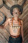 Wangchah Wangsa, Naga headhunter, with tattooed face and tribal necklace, and chest tattoo marking him as having taken heads, Nagaland, India, Asia