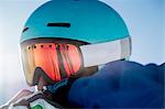 Portrait of skier, wearing ski goggles, close-up