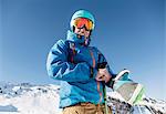 Portrait of skier in snow, low angle view