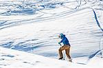 Skier skiing on mountainside