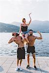 Portrait of three young hipsters posing at lake Como, Como, Lombardy, Italy