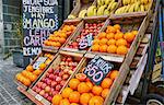 Fresh apples and oranges in crates on market stall, Montevideo, Uruguay, South America