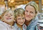 Portrait of mother and son looking at camera smiling