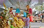 Mother and sons shopping at fruit and veg stall at market, Montevideo, Uruguay, South America