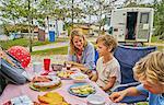 Family at picnic table celebrating boys birthday, Florianopolis, Santa Catarina, Brazil, South America