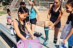 Schoolgirls preparing on school sports field