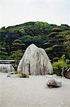 Stone rock in a Japanese Buddhist temple garden.