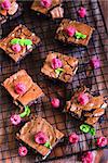 Brownie squares decorated with fresh raspberry and mint leaves