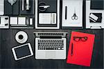 Corporate business office desktop with laptop, tablet and office accessories, flat lay