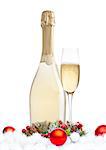 Bottle and glass of champagne with christmas decoration on white background
