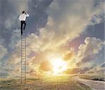 Businessman on a stairs looks far for new business