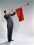 1960s MAN BLOWING PAGEANT TYPE TRUMPET WITH PENNANT FLAG ANNOUNCEMENT EVENT OCCASION